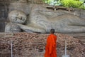 Child Monk Contemplating Reclining Buddha, Sri Lanka