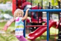 Child on monkey bars. Kid at school playground Royalty Free Stock Photo