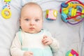 Child 3 months old lies alone in bed Royalty Free Stock Photo