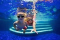 Child with mother dive in swimming pool Royalty Free Stock Photo