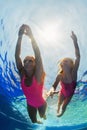 Child with mother dive in swimming pool Royalty Free Stock Photo