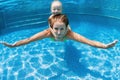 Child with mother dive in swimming pool Royalty Free Stock Photo