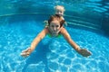 Child with mother dive underwater in swimming pool Royalty Free Stock Photo