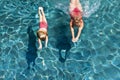 Child with mother dive underwater in swimming pool Royalty Free Stock Photo