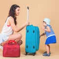 Child with mother ready to travel