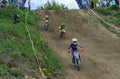 LVIV, UKRAINE - MAY, 2019: Child motorcycle racer rides and jumps on an enduro motorcycle on a motocross track