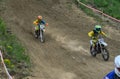 LVIV, UKRAINE - MAY, 2019: Child motorcycle racer rides and jumps on an enduro motorcycle on a motocross track