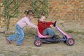 Child Moves Pedal Car