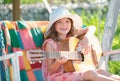 Child musician playing the guitar like a rockstar. Summer activity for children in warm weather. Cute little girl having Royalty Free Stock Photo