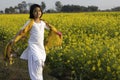 child in mustard flower field Royalty Free Stock Photo