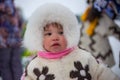 A child in the national costume of the Khanty people at a traditional holiday in the north. Russia, Kogalym