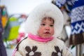 A child in the national costume of the Khanty people at a traditional holiday in the north. Russia, Kogalym