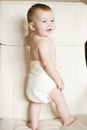 Child in a natural reusable, cotton baby diaper