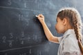 Child near the blackboard