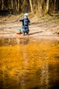 Child near water alone playing