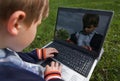 Child with notebook outdoor Royalty Free Stock Photo