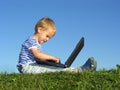 Child with notebook sit blue sky Royalty Free Stock Photo