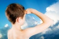 Child observes restless sky Royalty Free Stock Photo