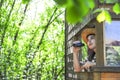 Child observing nature in his cabin