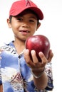 Child offering apple
