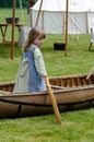 child and old canoe