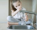 Child open tap. Kitchen faucet. Filtration system, water purification at home. Hydration. Healthy lifestyle. Water quality check