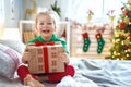 Child opening Christmas present Royalty Free Stock Photo