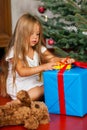 Child opening Christmas presents Royalty Free Stock Photo