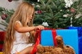 Child opening Christmas presents Royalty Free Stock Photo