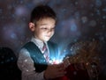 Child opening a magic gift box Royalty Free Stock Photo