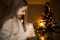 Child opens envelope of advent calendar