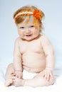 Child with orange frontlet on her head Royalty Free Stock Photo