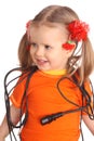 Child in orange t-shirt with wire.