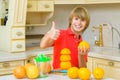 Child with oranges. Boy squeez fresh orange juice