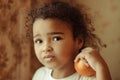 Child with oranges. Happy little girl with fruit. Royalty Free Stock Photo