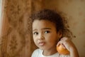 Child with oranges. Happy little girl with fruit. Royalty Free Stock Photo