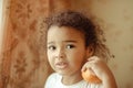 Child with oranges. Happy little girl with fruit. Royalty Free Stock Photo