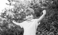 Child outdoors in nature. Happy child. Funny baby boy isolated on a background of green trees. Smiling child boy Royalty Free Stock Photo