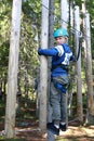 Child overcoming hanging logs obstacle