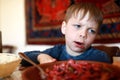 Child overeat salad of beetroot Royalty Free Stock Photo