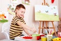 Child paint picture in preschool. Royalty Free Stock Photo