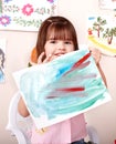 Child paint picture in preschool. Royalty Free Stock Photo