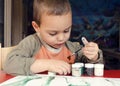 Child painting with brush Royalty Free Stock Photo