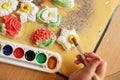 Child painting a ceramic pottery Royalty Free Stock Photo