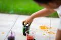 Child painting easter egg