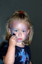 Child painting face Royalty Free Stock Photo