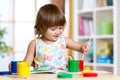 Child painting in kindergarten or playschool Royalty Free Stock Photo