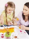 Child painting in preschool. Royalty Free Stock Photo