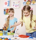 Child painting in preschool. Royalty Free Stock Photo