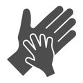 Child palm in adult hand solid icon, 1st june Children protection day concept, Parent and kid hands sign on white